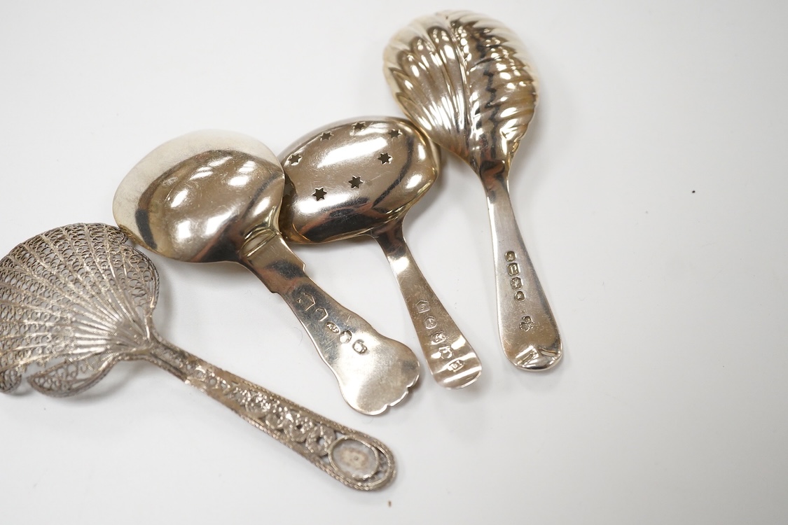 Three assorted silver caddy spoons, including star cut bowl by John Thropp, Birmingham, 1817, 69mm, hourglass? pattern, Joseph Wilmore, marks rubbed, bright cut engraved handle London, 1856 and a filigree white metal spo